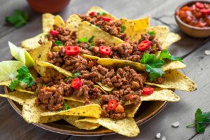 Mexican,nacho,corn,tortilla,chips,with,meat,and,red,hot