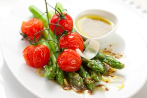 Green,asparagus,with,roasted,tomatoes,cheese,and,lemon,mustard,dressing