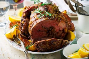 Roast,lamb,leg,with,vegetables.style,rustic.selective,focus