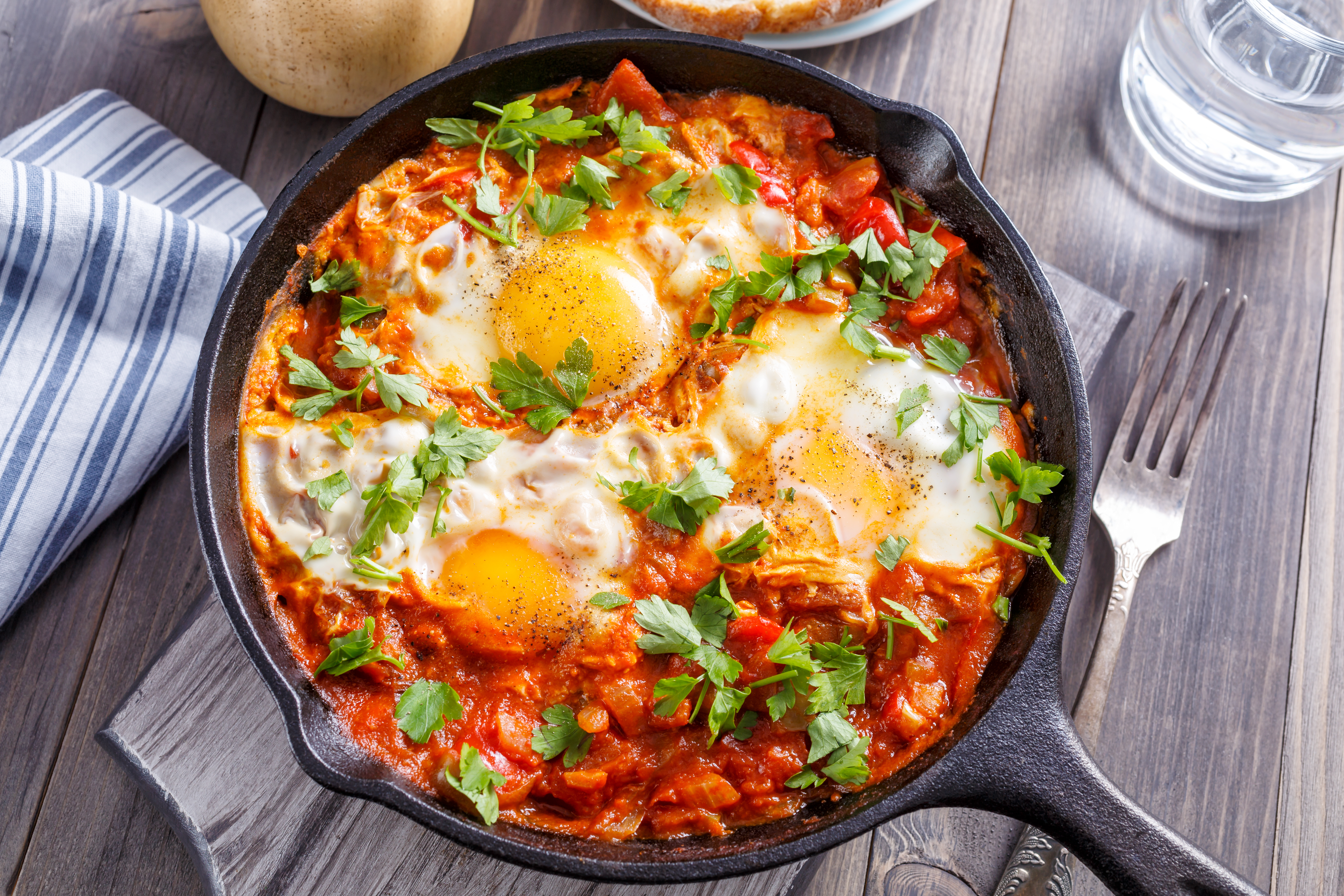 Tasty,and,healthy,shakshuka,in,a,frying,pan.,eggs,poached